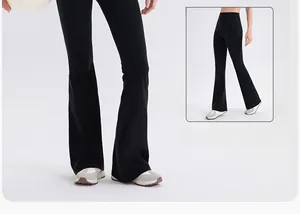 Detail view of high-waist flared black yoga pants with professional slimming leg silhouette