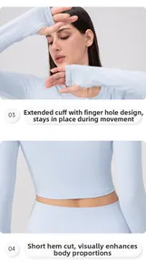 Detail of light blue sports top showing thumbhole cuffs and a short cropped waist design