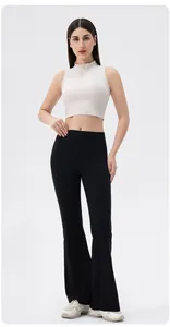 Haut de yoga sans manches avec fermeture éclair et leggings évasés à taille haute