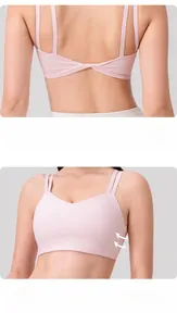 Detailed back view of pink yoga sports bra with criss-cross straps and seamless fabric