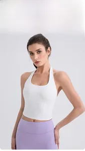 Detailed view of white halter yoga vest paired with high-waist purple leggings for fitness