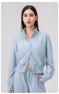 Detail of light blue yoga jacket with high collar and two-way zipper for sports