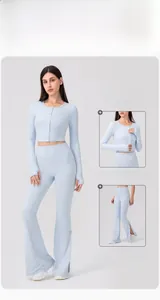 Detail view of light blue yoga cardigan with thumbholes and flared fitness leggings