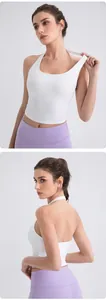 Front and back view of white halter yoga tank top and lilac high-waisted leggings
