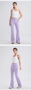 Detailed view of white halter yoga top and purple high-waist flared leggings set