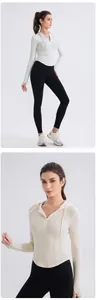 Detail of slim fit yoga hoodie with thumbholes and high waist leggings for fitness