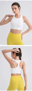 Close-up of white racerback sports bra and yellow high-waisted leggings set detail