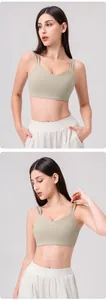 Detail view of avocado green sports bra with double thin straps and V-neckline design