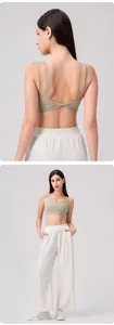 Detailed back view of a green yoga sports bra featuring a unique twisted knot design