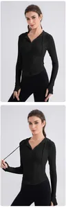 Detail of slim fit yoga hoodie featuring thumb holes and a half-zip neckline design