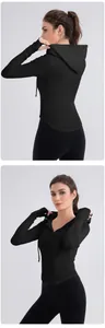 Close-up of slim-fit hooded yoga top with thumbholes and ribbed fabric detail