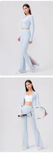 Detail of light blue yoga set with side slits and traditional Chinese button accents