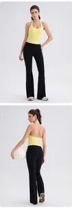 Front and back view of a yellow halter yoga top and black flare pants set for fitness
