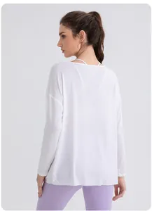 Back view of loose modal yoga top showing breathable white fabric and draped fit