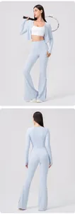 Detail view of Lycra yoga top with thumbholes and split-hem flared fitness leggings