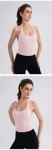 Detailed view of a light pink halter yoga vest with U-neck and elastic slim fit fabric