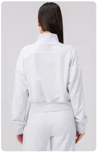 Rear view of loose heather grey yoga jacket with ribbed hem and soft knit texture