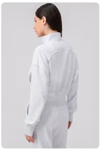 Detail view of the arched back seam on this gray loose-fit women's sports jacket