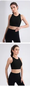Detail view of black high-impact lycra yoga sports bra and high-waist fitness leggings