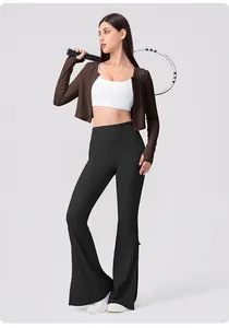 Close-up of brown long sleeve yoga cardigan with thumbholes and white sports tank top