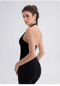Rear view of black halter yoga tank top showing backless cross design and fabric texture