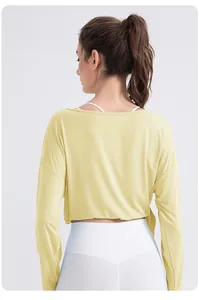 Detail view of the soft breathable fabric and relaxed fit back design on yoga top