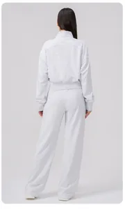 Rear view of a light grey loose-fit sports sweatshirt and wide-leg jogger pants set