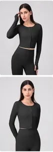 Close-up of black Lycra yoga cardigan featuring button-up front and thumbholes