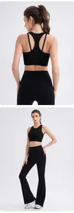 Detail of black cross-back yoga bra and high-waisted flare leggings sports set
