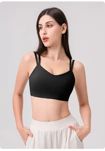 Detail shot of black high-elastic yoga bra with thin double straps and V-neckline