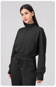 Close-up of ribbed cuffs and high-quality knit texture on a black zipper sports jacket