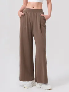 Women's dark brown wide leg sports trousers with elastic high waist and soft drape