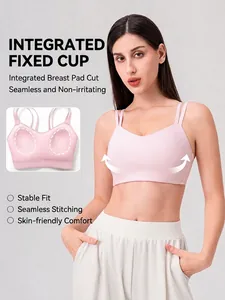 Pale pink seamless yoga bra with fixed cups and thin double straps for fitness