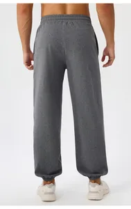 Rear view of men's loose yoga pants with elastic waistband and ribbed ankle cuffs