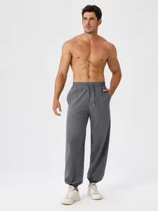 Men's loose fit deep gray joggers with drawstring waist and ribbed cuffs for fitness