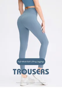 Detail of high-waist yoga leggings in foggy blue with peach-lift stitching and stretch fit