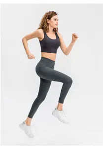 Running model showing stretch fit of charcoal gray high-waisted yoga set with side pocket