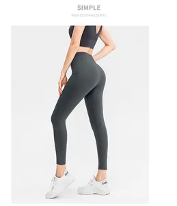 Detail view of dark grey high-waist yoga leggings and sports bra with seamless texture