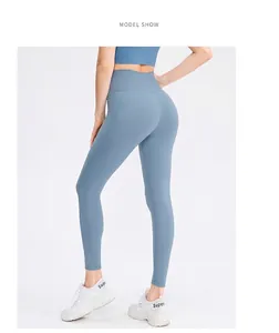 Rear view of high-waisted dusty blue yoga pants showing lifting and sculpting effect