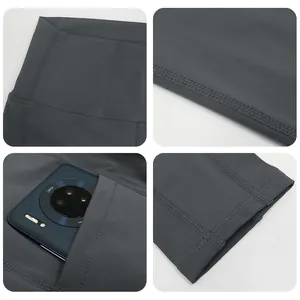 High-waisted dark grey yoga leggings with side pockets and flat-seam construction
