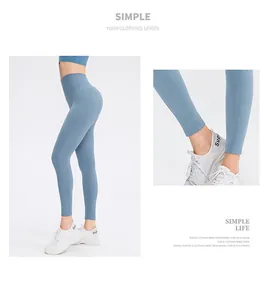 Detail view of high-waisted yoga leggings in misty blue with elastic compression fit