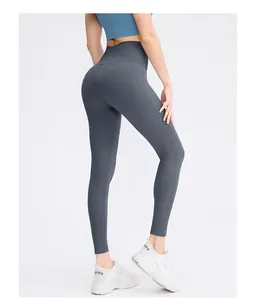Detail view of high-waisted dark grey yoga pants with seamless stitching and booty lift effect