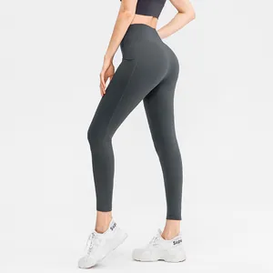 High-waist dark grey yoga leggings with side pockets and slimming butt lift effect