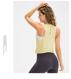 Close-up of pale yellow yoga vest featuring a breathable hollow out back design