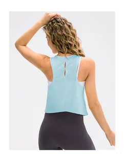 Detail view of the hollow-out racerback design on light blue yoga tank top for women