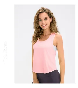 Detail of light pink sleeveless yoga top with wide armholes and breathable fabric texture