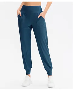 Détails du jogging bleu foncé à taille haute avec poches latérales et bords-côtes