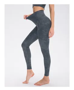 Detail of high waist yoga leggings showing stretch fabric in grey marble tie-dye print
