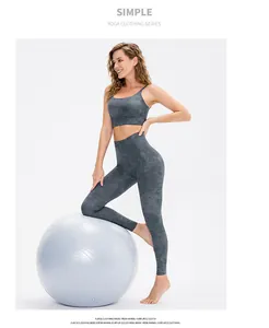 Detail of high-waist marble print yoga set with racerback bra and seamless leggings
