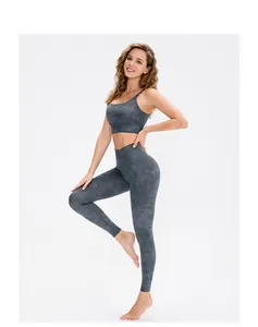 Detail of high waist yoga set showing dark grey marble tie-dye texture and stretch fabric